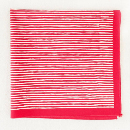 Red and white striped bandana on a white background