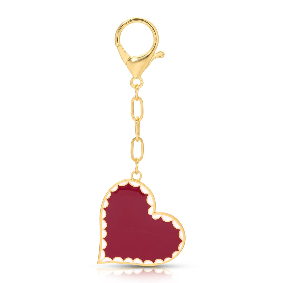 red enameled heart bag charm open on white background