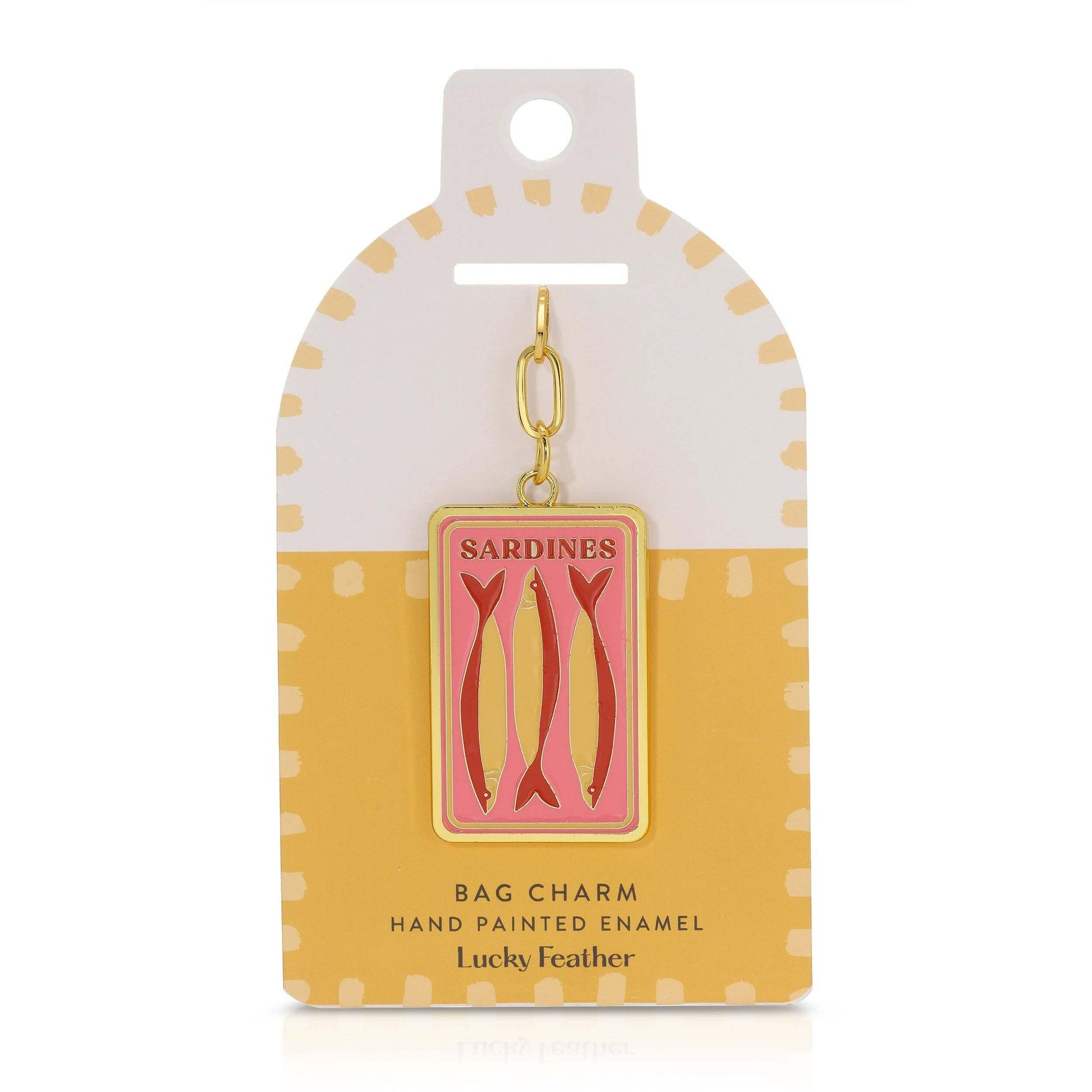 Sardine bag charm on a polka dot card with 'Lucky Feather' branding.