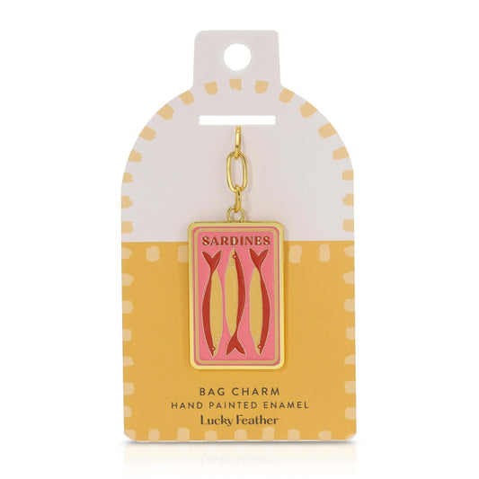 Sardine bag charm on a polka dot card with 'Lucky Feather' branding.