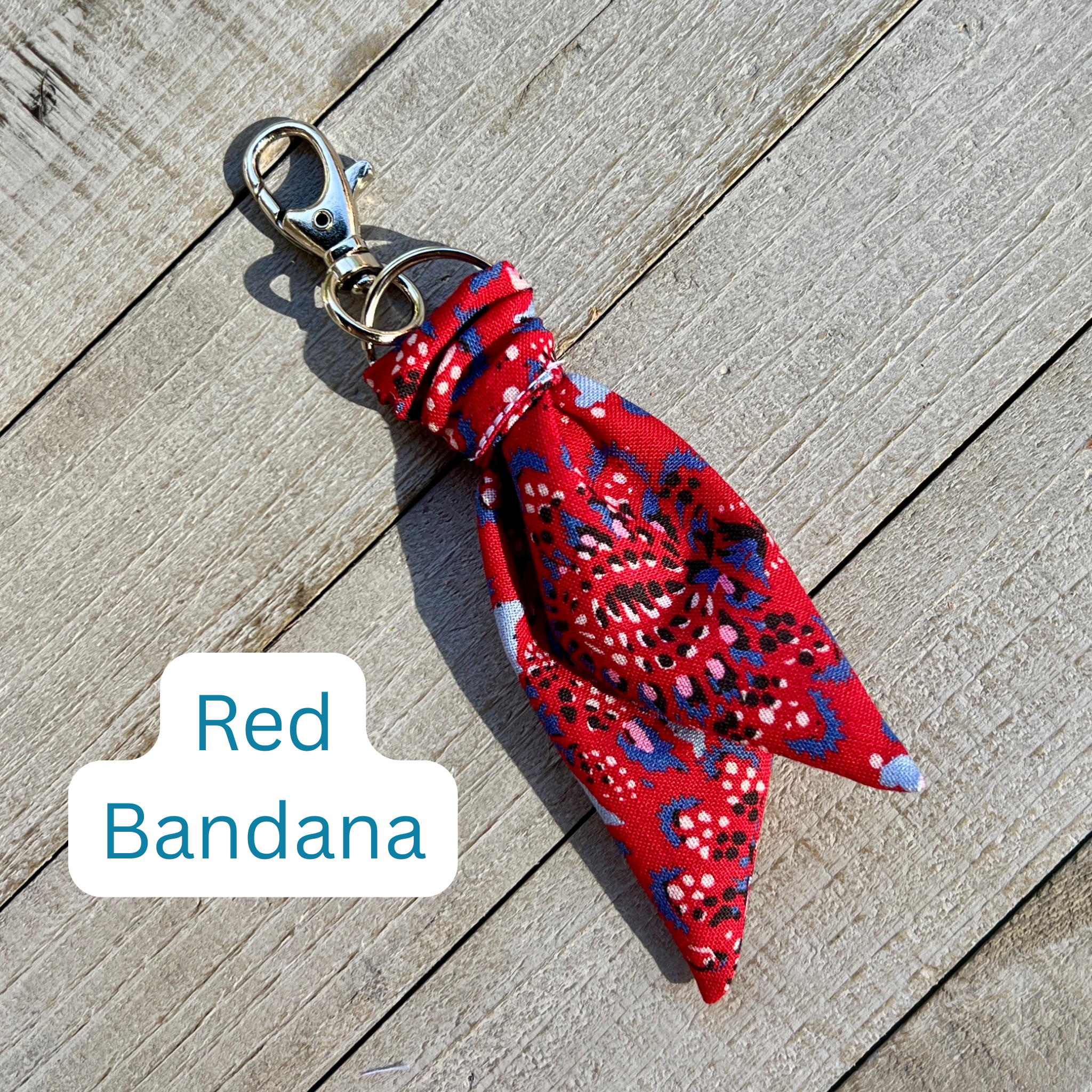 Red bandana keychain on a wooden surface with 'Red Bandana' text overlay.