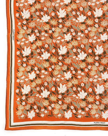 Floral patterned fabric with orange border, featuring the brand 'Flora West'.