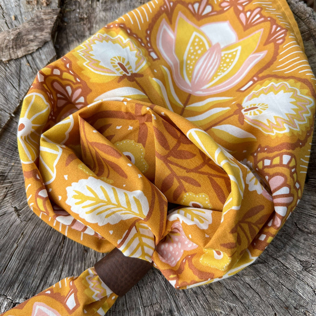 Floral patterned headscarf on a wooden surface