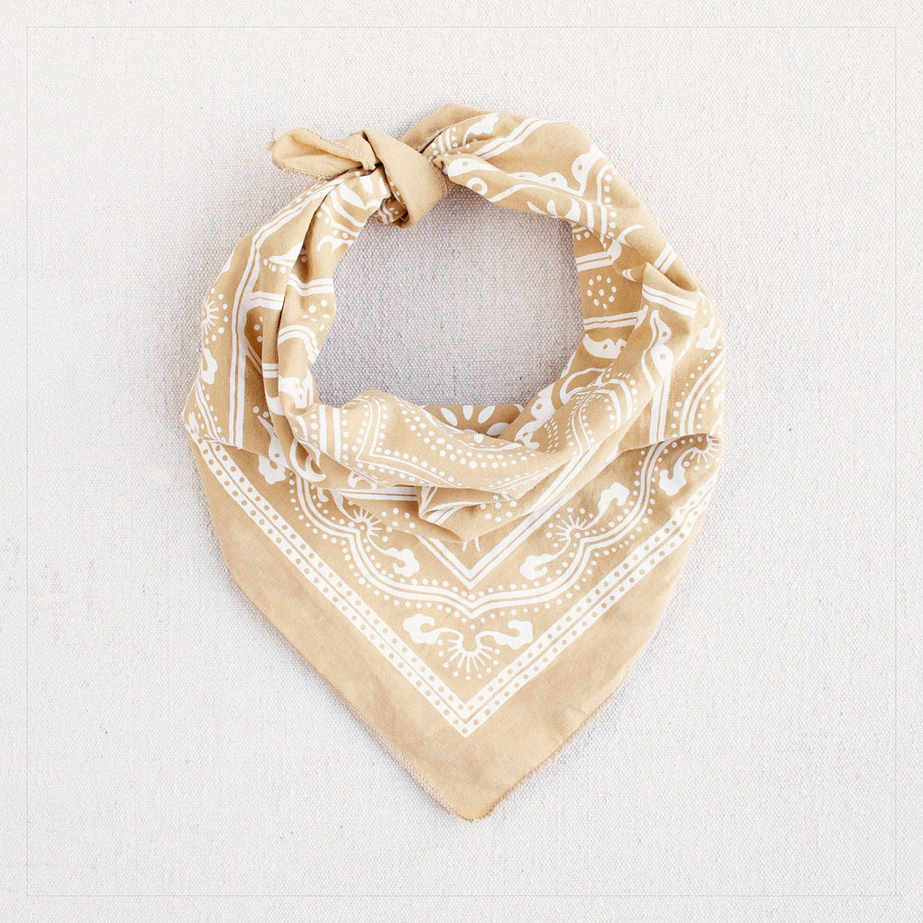 Beige bandana with white pattern on a light gray background