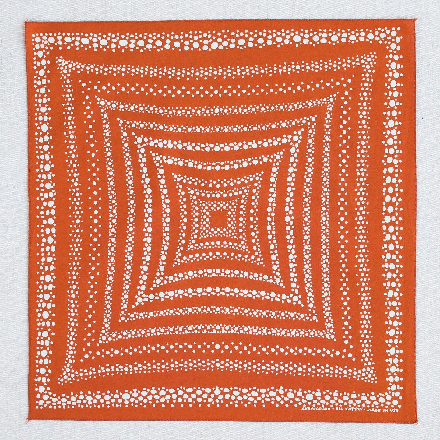 white dot patterned orange bandana