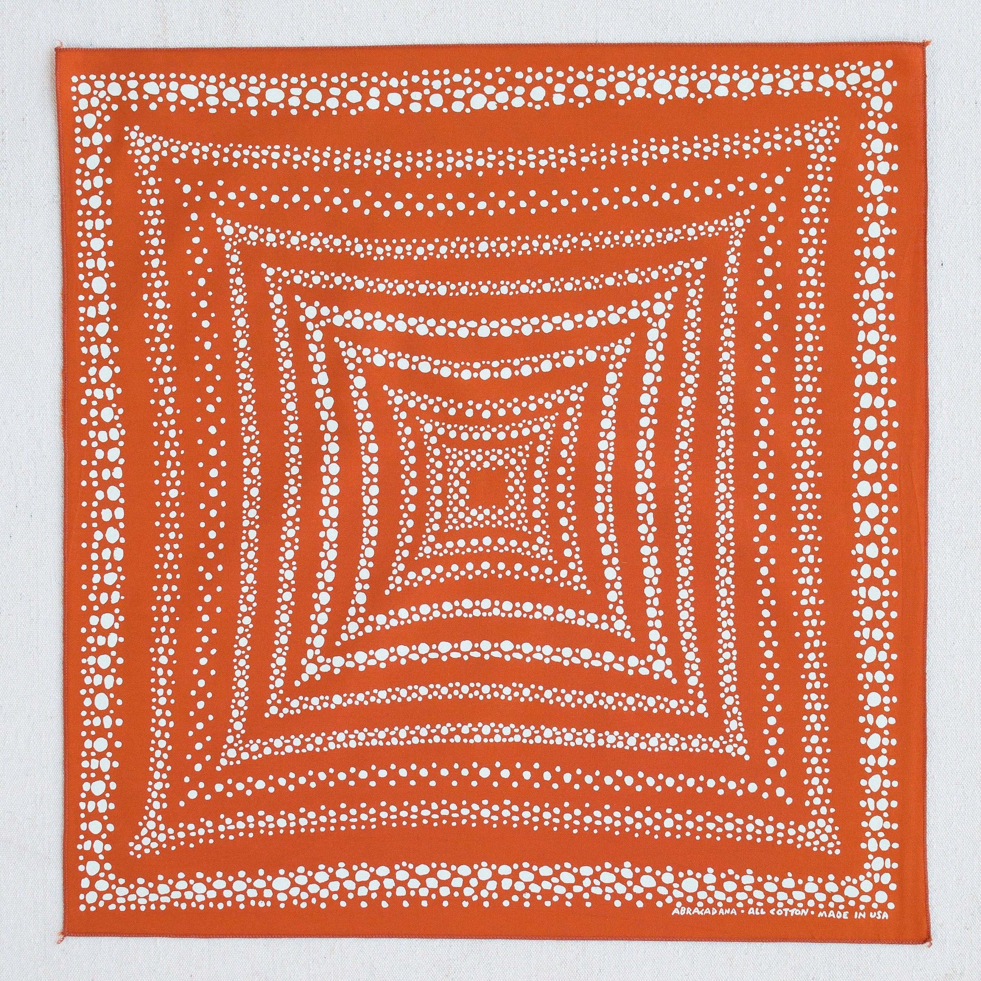 white dot patterned orange bandana