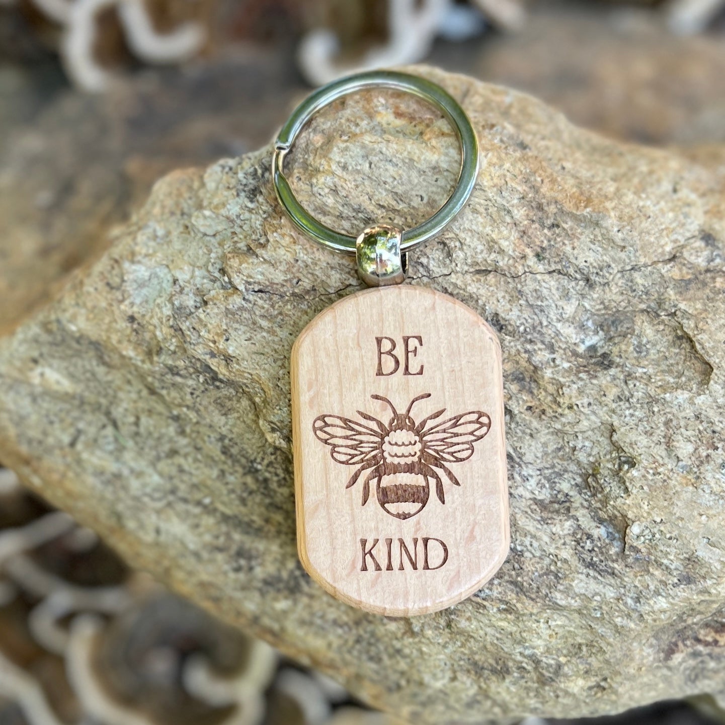 wooden keychain with engraved bee and be kind words