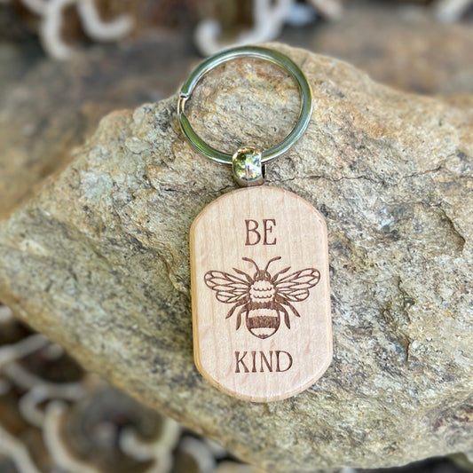 wooden keychain with engraved bee and be kind words