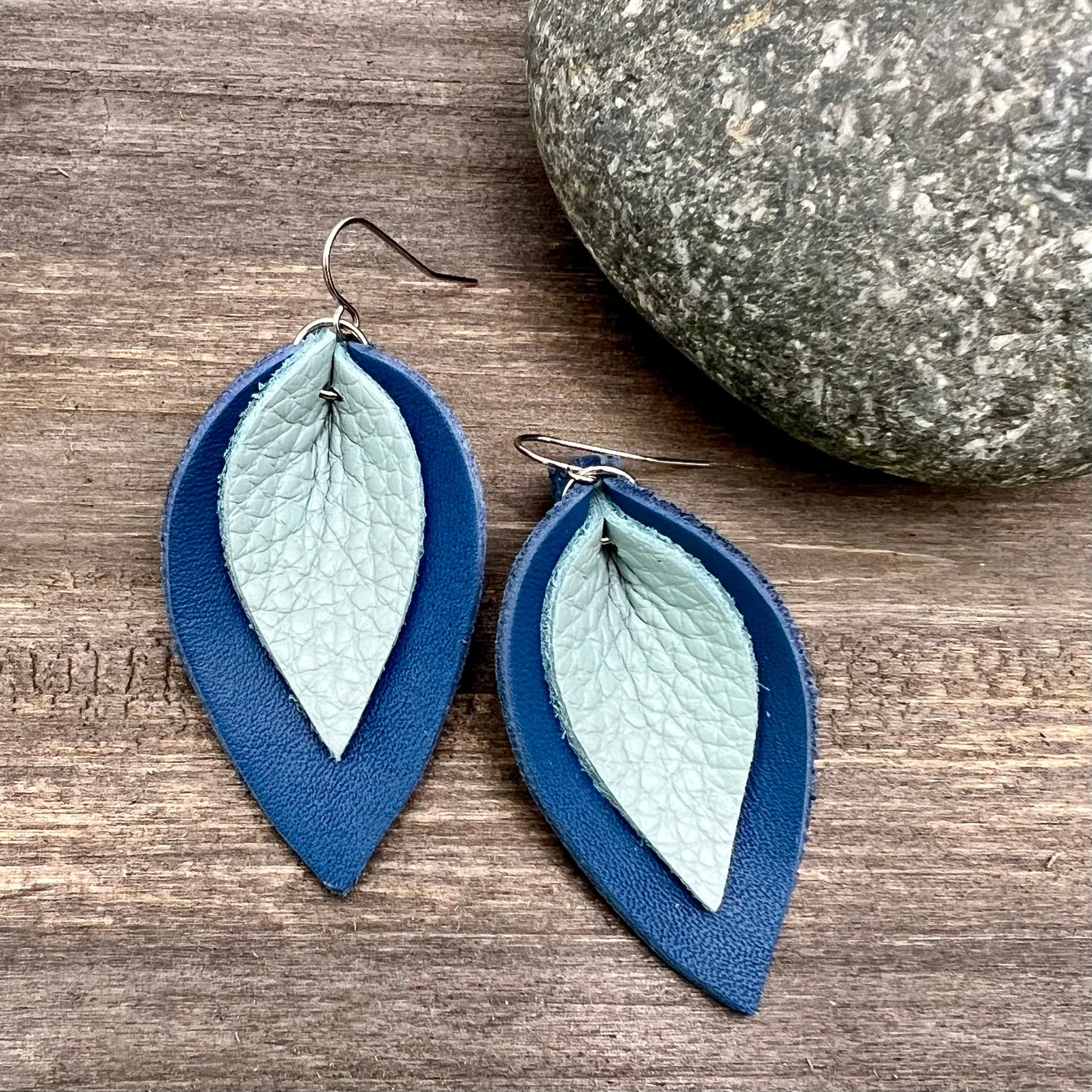 layered leather earrings in light blue on bright blue