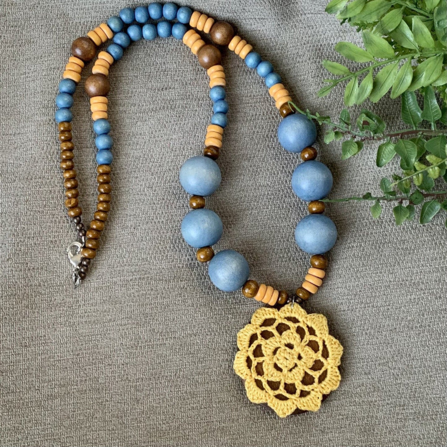 long wood bead necklace with crochet pendant